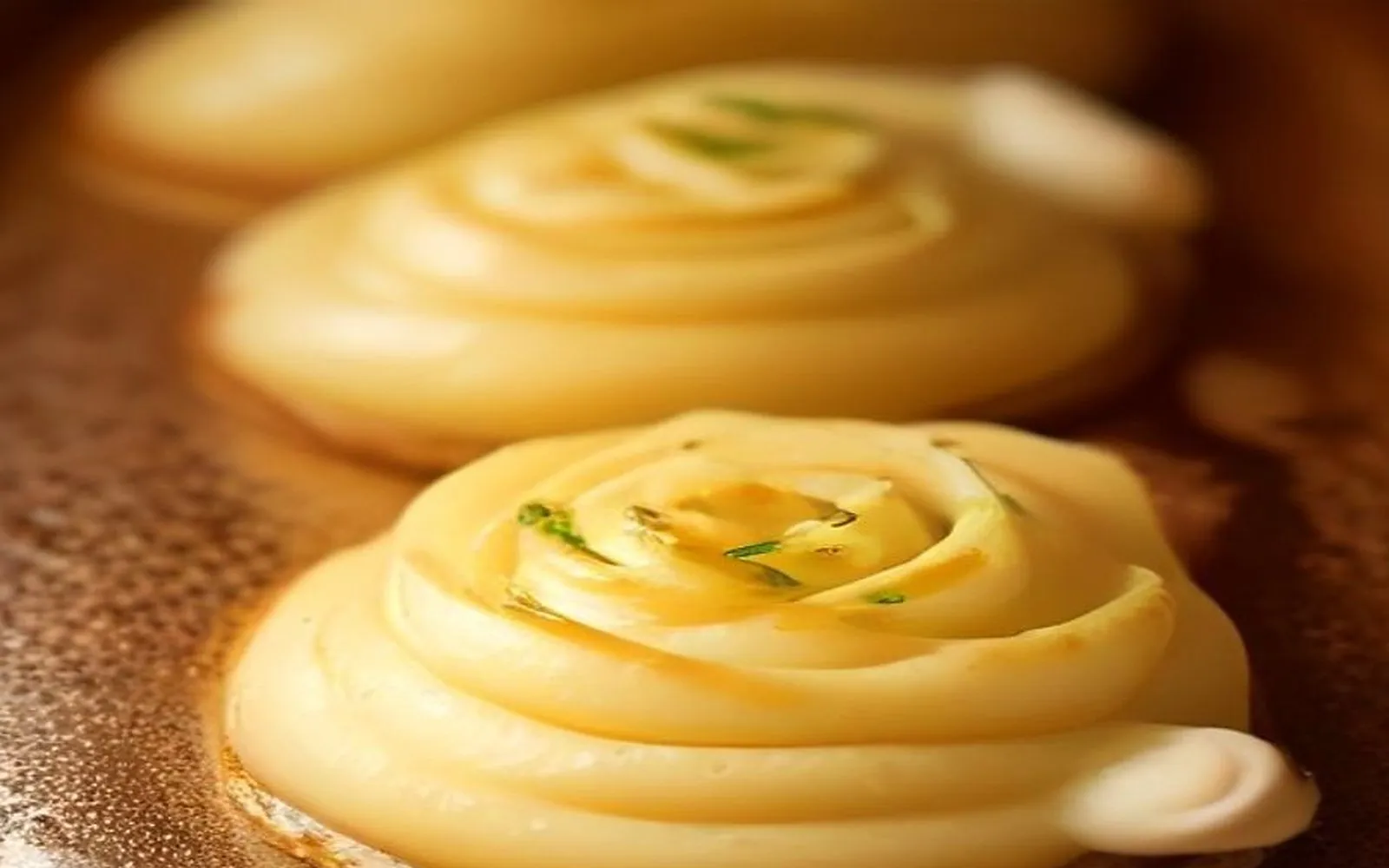 Gluten-free duchess potatoes on a plate